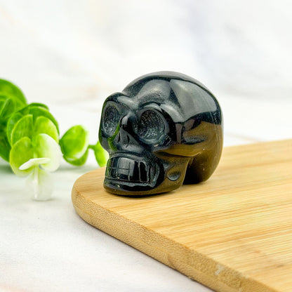 crâne en obsidienne dorée