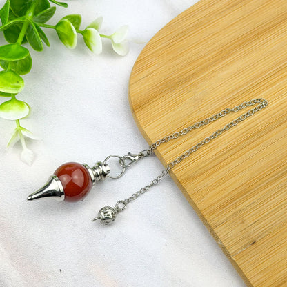 pendule boule en cornaline